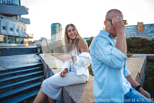 Image of Tanned young caucasian couple, modern lovestory in film grain effect