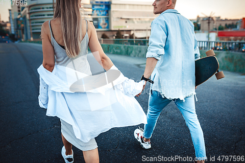 Image of Tanned young caucasian couple, modern lovestory in film grain effect