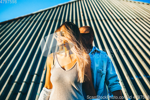 Image of Tanned young caucasian couple, modern lovestory in film grain effect