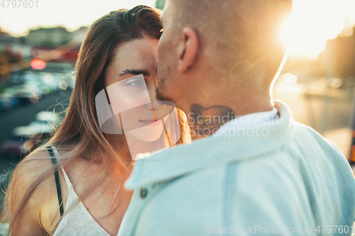 Image of Tanned young caucasian couple, modern lovestory in film grain effect