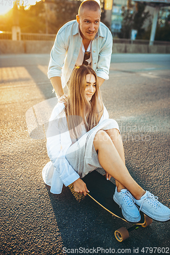 Image of Tanned young caucasian couple, modern lovestory in film grain effect