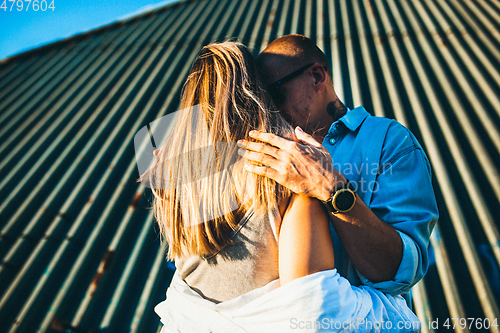 Image of Tanned young caucasian couple, modern lovestory in film grain effect