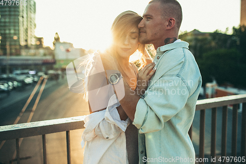 Image of Tanned young caucasian couple, modern lovestory in film grain effect