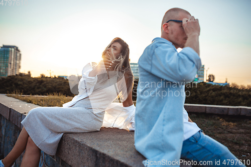 Image of Tanned young caucasian couple, modern lovestory in film grain effect