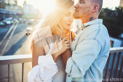 Image of Tanned young caucasian couple, modern lovestory in film grain effect