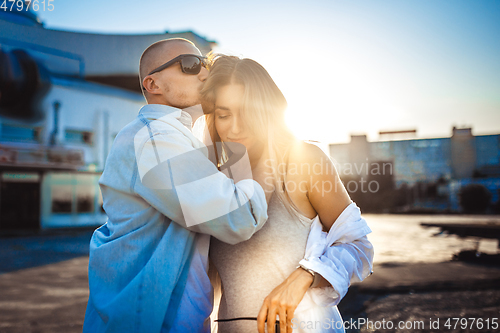 Image of Tanned young caucasian couple, modern lovestory in film grain effect