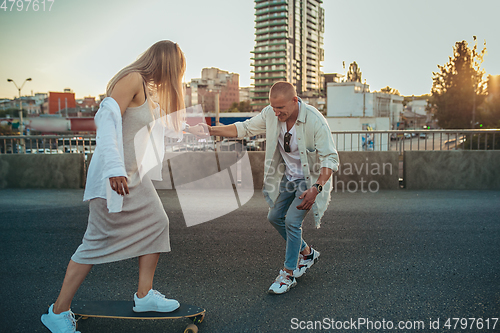 Image of Tanned young caucasian couple, modern lovestory in film grain effect