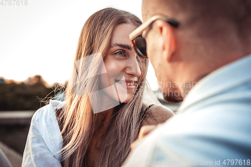 Image of Tanned young caucasian couple, modern lovestory in film grain effect