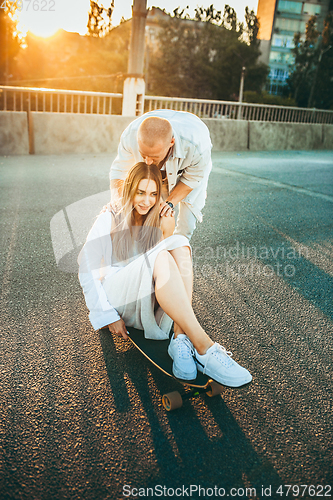 Image of Tanned young caucasian couple, modern lovestory in film grain effect