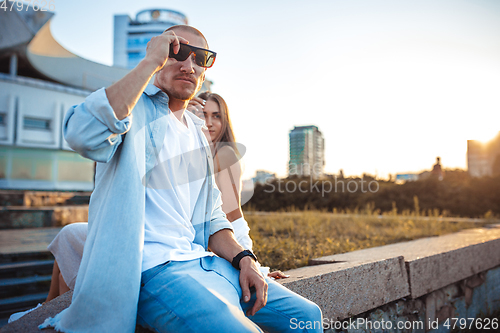 Image of Tanned young caucasian couple, modern lovestory in film grain effect