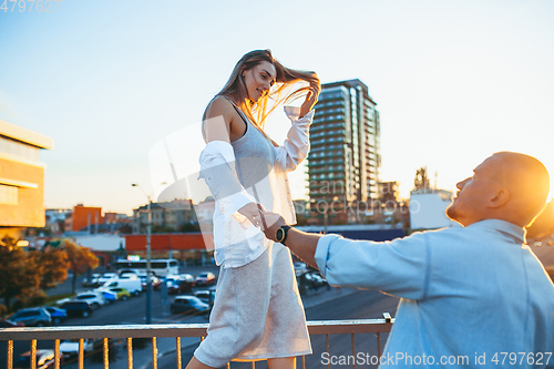 Image of Tanned young caucasian couple, modern lovestory in film grain effect