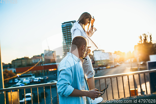 Image of Tanned young caucasian couple, modern lovestory in film grain effect