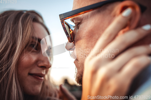 Image of Tanned young caucasian couple, modern lovestory in film grain effect