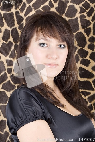 Image of portrait of the young beauty woman in black dress