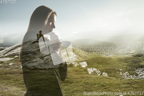 Image of Silhouette of businesswoman with landscapes on background, double exposure.
