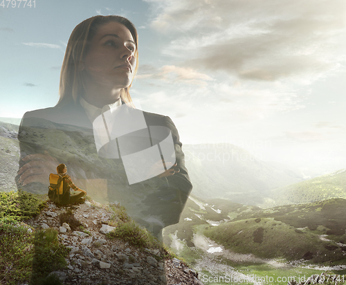 Image of Silhouette of businesswoman with landscapes on background, double exposure.