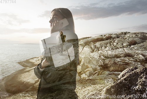 Image of Silhouette of businesswoman with landscapes on background, double exposure.