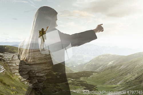 Image of Silhouette of businesswoman with landscapes on background, double exposure.