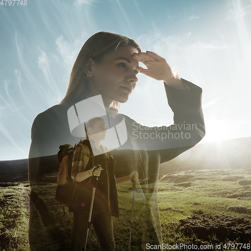 Image of Silhouette of businesswoman with landscapes on background, double exposure.