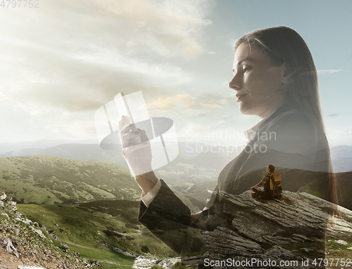 Image of Silhouette of businesswoman with landscapes on background, double exposure.