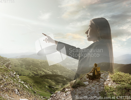 Image of Silhouette of businesswoman with landscapes on background, double exposure.