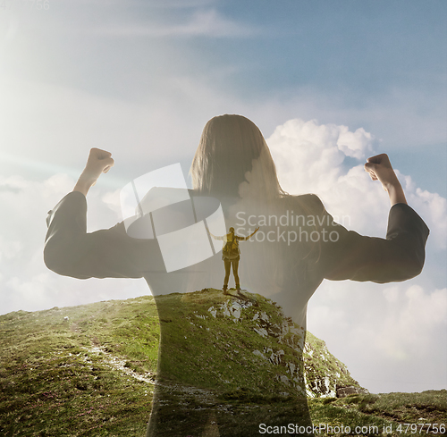 Image of Silhouette of businesswoman with landscapes on background, double exposure.