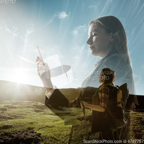 Image of Silhouette of businesswoman with landscapes on background, double exposure.