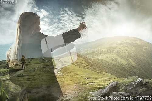 Image of Silhouette of businesswoman with landscapes on background, double exposure.