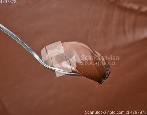 Image of spoon of chocolate hazelnut cream