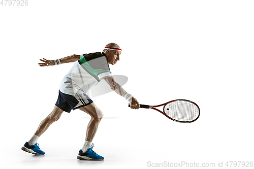 Image of Senior man playing tennis in sportwear isolated on white background