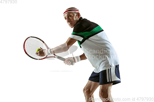 Image of Senior man playing tennis in sportwear isolated on white background