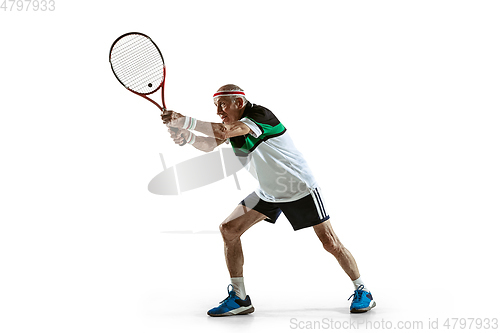 Image of Senior man playing tennis in sportwear isolated on white background