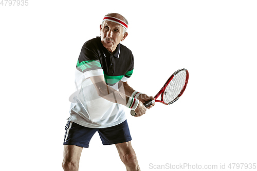 Image of Senior man playing tennis in sportwear isolated on white background