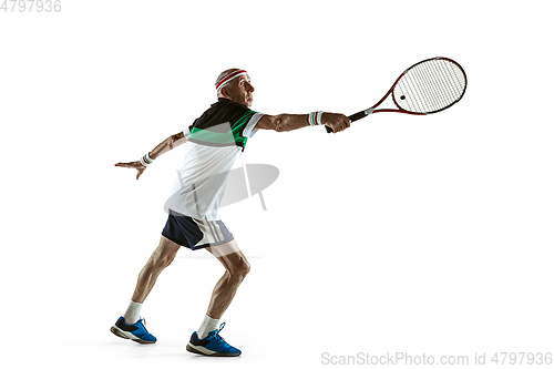 Image of Senior man playing tennis in sportwear isolated on white background