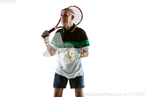 Image of Senior man playing tennis in sportwear isolated on white background