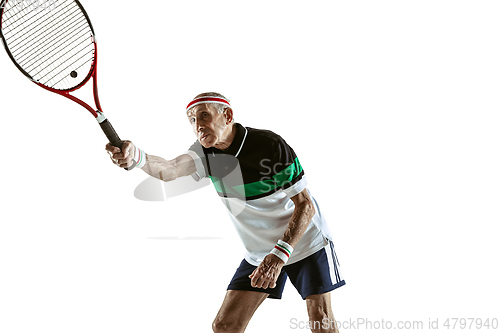 Image of Senior man playing tennis in sportwear isolated on white background