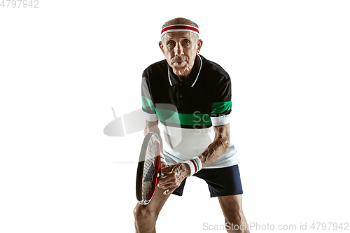 Image of Senior man playing tennis in sportwear isolated on white background