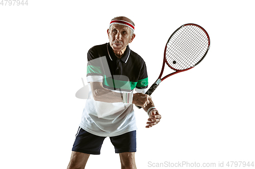 Image of Senior man playing tennis in sportwear isolated on white background