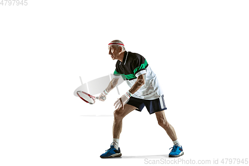 Image of Senior man playing tennis in sportwear isolated on white background