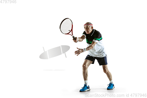 Image of Senior man playing tennis in sportwear isolated on white background