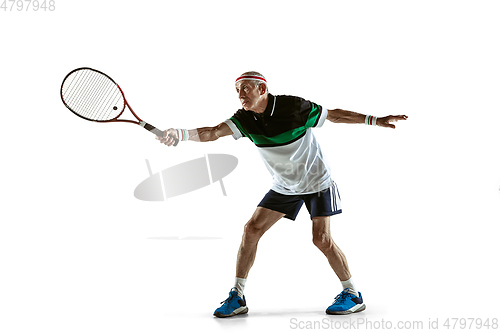 Image of Senior man playing tennis in sportwear isolated on white background