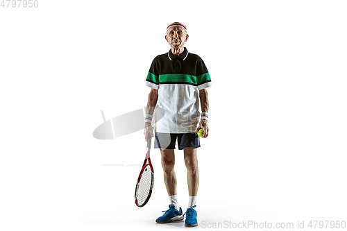 Image of Senior man playing tennis in sportwear isolated on white background