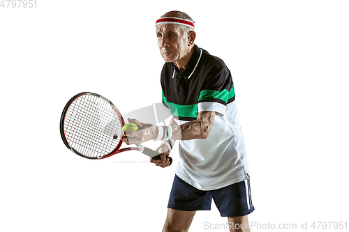 Image of Senior man playing tennis in sportwear isolated on white background