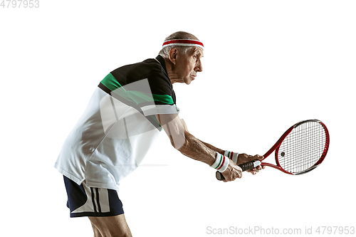 Image of Senior man playing tennis in sportwear isolated on white background