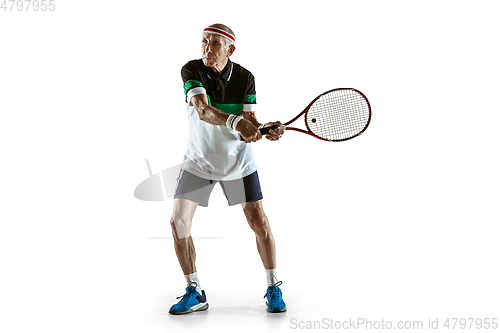 Image of Senior man playing tennis in sportwear isolated on white background