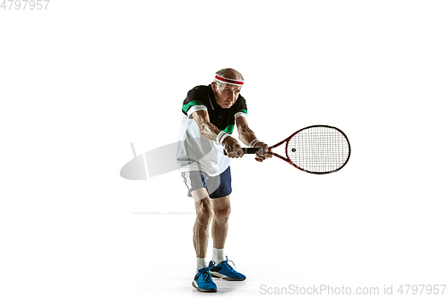 Image of Senior man playing tennis in sportwear isolated on white background