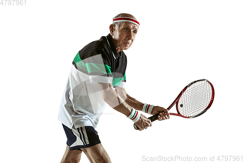 Image of Senior man playing tennis in sportwear isolated on white background