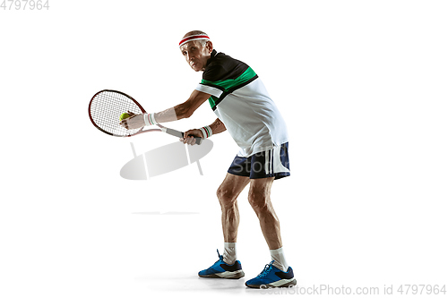 Image of Senior man playing tennis in sportwear isolated on white background