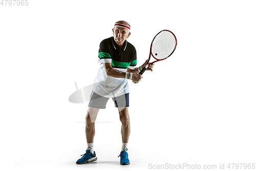 Image of Senior man playing tennis in sportwear isolated on white background