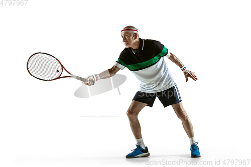 Image of Senior man playing tennis in sportwear isolated on white background